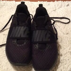 Women’s all black Nike Tennis shoes